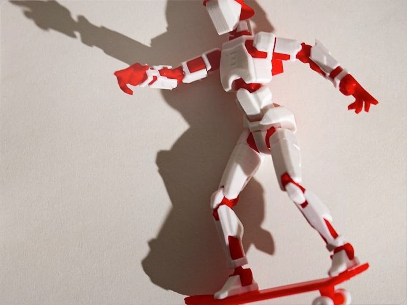 Red and white Dummy 13 skateboard figure in a group action scene
